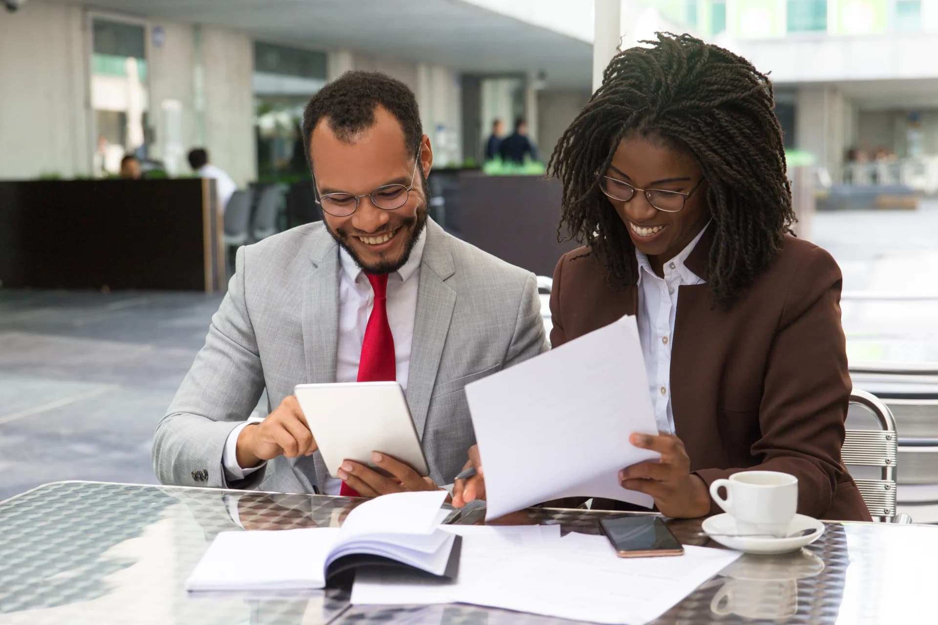 Loan officers reviewing borrower documents together